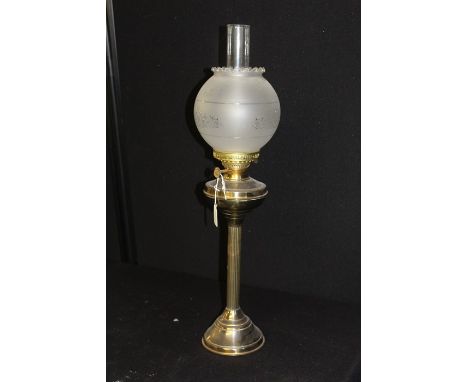 Duplex bras oil lamp, the frosted glass shade with etched foliate decoration, on a reeded stem and domed foot