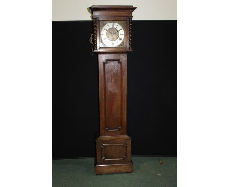 20th Century oak cased longcase clock, the hood with barley twist pilasters, the silvered chapter ring with Roman numerals, s