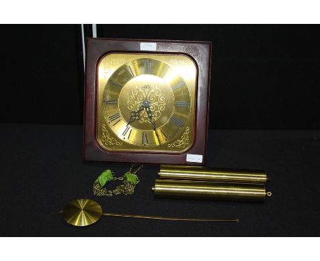 AMS wall clock, the brass dial with Roman numerals, housed in a mahogany frame, with hanging pendulum and weights, 28.5cm wid