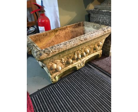 A Large heavy garden trough style planter, Detailed with fruit and leaf designs 