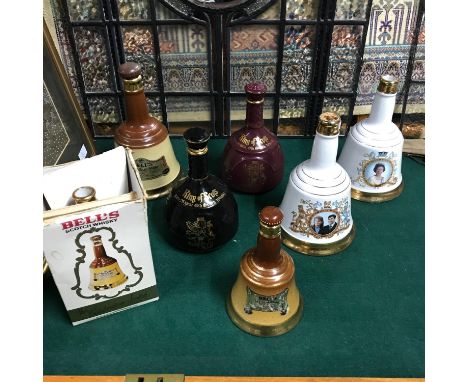A Lot of vintage whisky decanter bottles. Includes King of Scotland x2 and Various Bells. All Empty. 