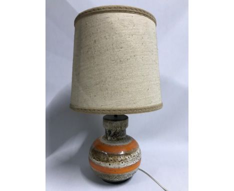 A Retro West German table lamp, detailing brown and orange porcelain base. With original canvas shade. 