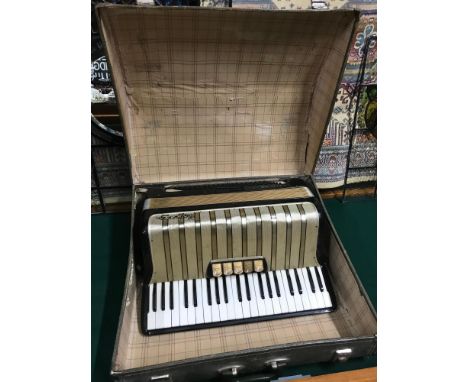A Vintage Hohner Arietta IVM Accordion with travel case. 