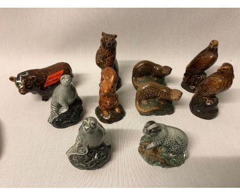 A lot of 10 Beswick whisky collectable bottles in the shape of animals. 8 full and sealed, 2 empty 