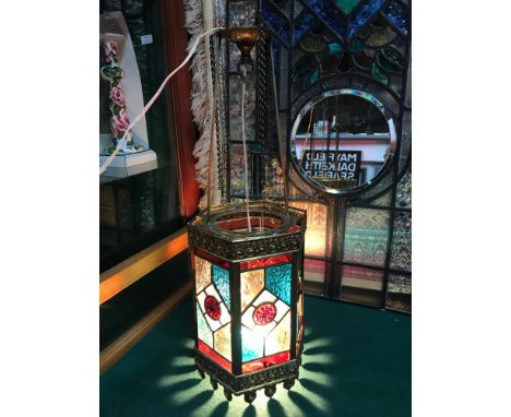 Antique Hexagonal brass and stain glass porch lantern or hall way lantern. In a working condition. Measures 62cm in length 