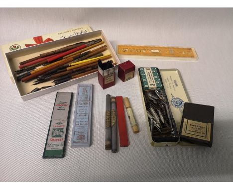 A selection of vintage writing items to include; fountain pens, leads and nibs etc 