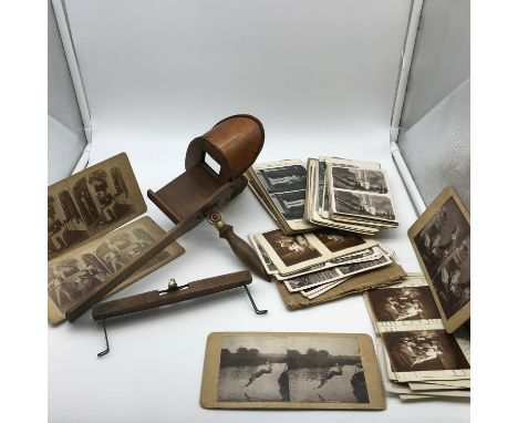 Antique hand held slide scope with various antique and vintage slides. 