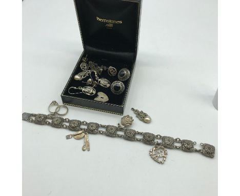 Antique silver charm bracelet with 4 charms, Together with 6 pair of silver earrings and various odd silver items. 