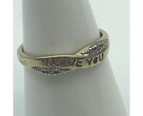 A Ladies 9ct gold and diamond "I LOVE YOU" Ring. Ring size M. Weighs 1.24grams 