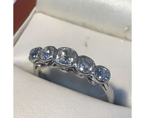 A Ladies 18ct white gold(unmarked) 5x diamond Victorian ring, Cushion cut diamonds in a rubover setting, Approx Diamond weigh