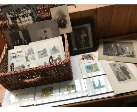 A Large Collection of Vintage Photos (Black and White) along with Framed Drawings By Ophelia Redpath placed in a Wicker Baske