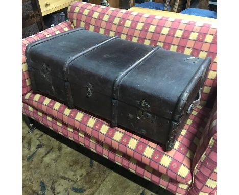 A Vintage wooden bound travel trunk. 