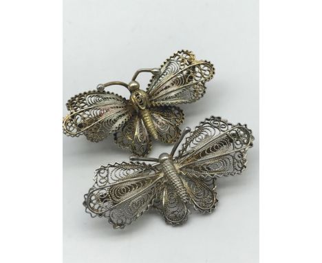 Two vintage filigree silver butterfly brooches. 