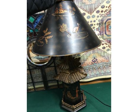 A Vintage resin and lacquered pagoda oriental table lamp with matching shade. (Shade needs attention)In a working condition.M