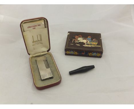 A Dunhill lighter housed in red box, together with a pack of miniature Russian cigars