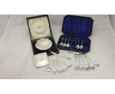 A set of six silver teaspoons and a pair of tongs, five other spoons and five various teaspoons and tongs, a small circular s