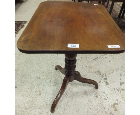 A 19th Century mahogany rectangular topped tilt-top occasional table, raised on baluster turned and ringed column to tripod b