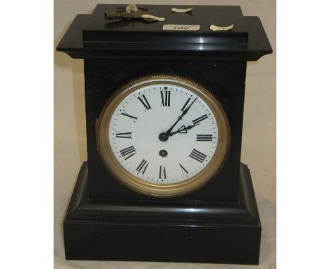 A Victorian slate cased mantel clock, the movement with circular enamelled dial and Roman numerals