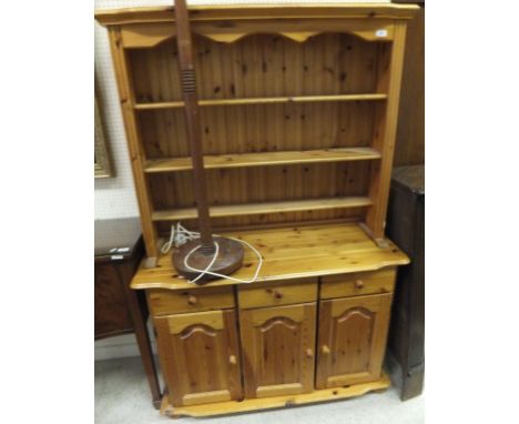 A modern pine dresser and a standard lamp CONDITION REPORTS General wear, scuffs, some marks and stains. Size approx 114cm wi