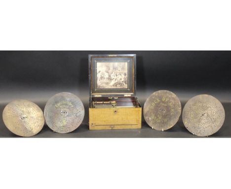 A Victorian walnut cased polyphon of plain form, together with eighteen discs