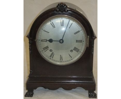 An early 20th Century mahogany cased dome-topped mantel clock, the eight day movement with Westminster chimes and silvered di