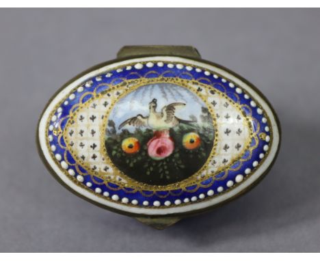 A late 18th century English enamel oval patch box of blue ground, the hinged lid painted with a circular reserve of a bord am