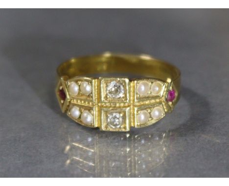 A late Victorian 18ct. gold ring set two small diamonds flanked by four pairs of seed pearls, a small ruby either side, Chest