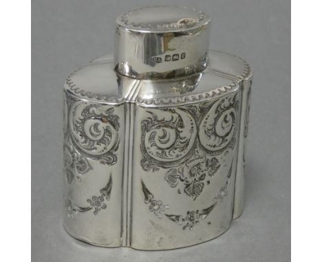 A late Victorian silver tea caddy of straight-sided lobed oval form, with embossed leaf-scroll decoration &amp; pull-off lid,