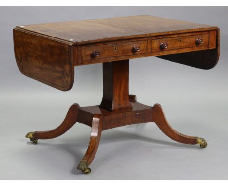 A regency mahogany sofa table, with ebonised line inlay, fitted two frieze drawers to one side with turned knob handles, on s