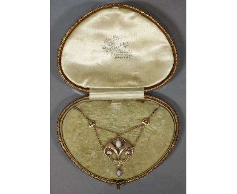 A Murrle Bennet  &amp; Co. 9ct. gold, opal, &amp; seed-pearl pendant of round open scroll design, on a 9ct. fine-link chain n