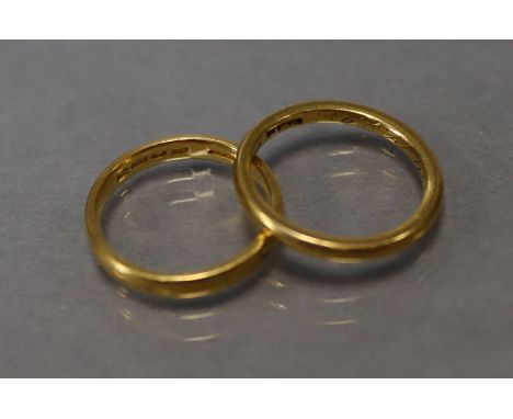 A 22ct. gold wedding band (size: M); &amp; another 22ct. gold wedding band (size: K/L); total weight: 7.1 gm.