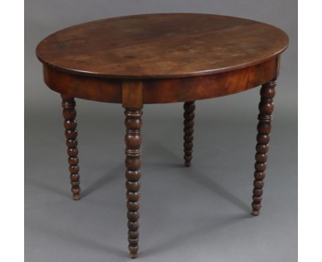 A 19th century mahogany oval centre table with two-piece overhang top, plain frieze, &amp; on bobbin-turned tapering legs; 40