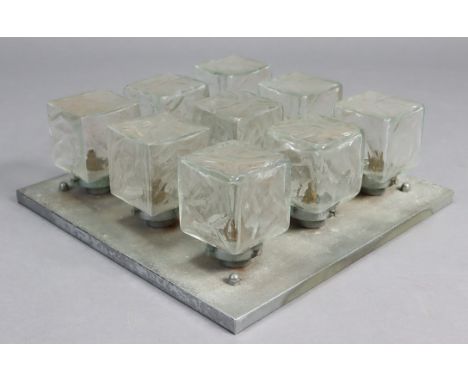 An Art Deco style ceiling light fitting with nine rectangular glass shades, on silvered-metal square mount; 19” x 19” x 6½” h