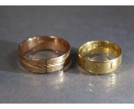 An 18ct. gold engraved band, size: J/K, weight: 2.6 gm.; &amp; an engraved 14K band, size: R, weight: 3.4 gm.