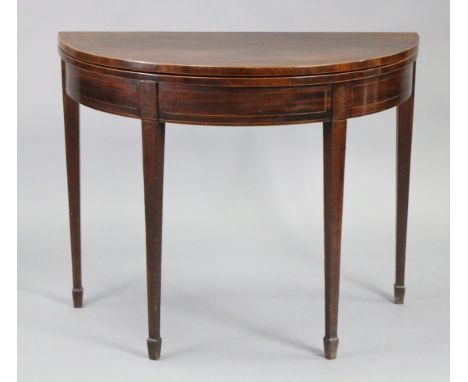 A 19th century inlaid mahogany demi-lune tea table with fold-over top supported by a gate-leg, on square tapered legs, 36” wi
