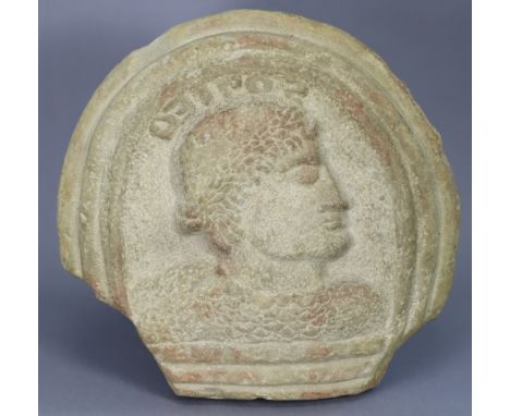 An Ancient carved sandstone relief portrait roundel depicting a male bust in profile; 15” x 15½”.