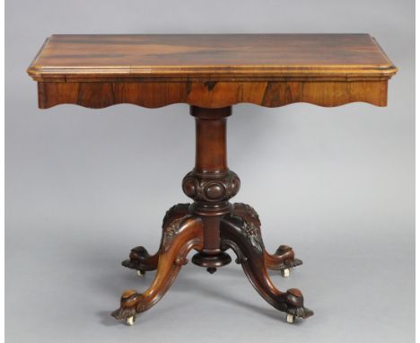 A Victorian rosewood tea table, with moulded edge to the rectangular fold-over top &amp; shaped frieze, on bulbous-turned &am