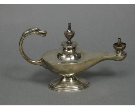 An Edwardian silver table cigar lighter in the form of a roman oil lamp with urn finial &amp; mythical beast scroll handle, 6