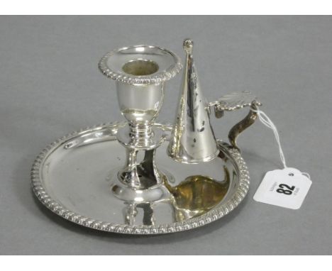 A George II silver chamber candlestick on wide circular base with gadrooned rim &amp; shell handle, plain snuffer cone, 5½” d