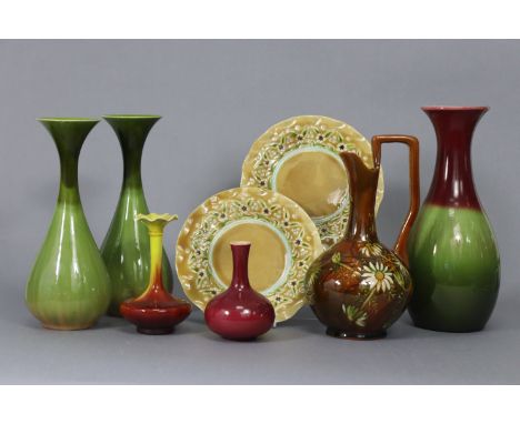 A Linthorpe pottery ovoid vase with puce flared neck &amp; green ovoid body, 9¾” high; a ditto pair of green-glazed 8¾” vases