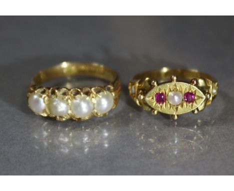 A Victorian 15ct. gold ring set two small rubies centred by a split pearl, Birmingham hallmarks for 1877 (?), size: J/K, weig