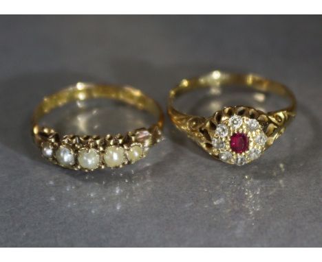 A late Victorian 18ct. gold ring set small ruby within a diamond border, Birmingham hallmarks for 1899, size: N, weight: 2.7 