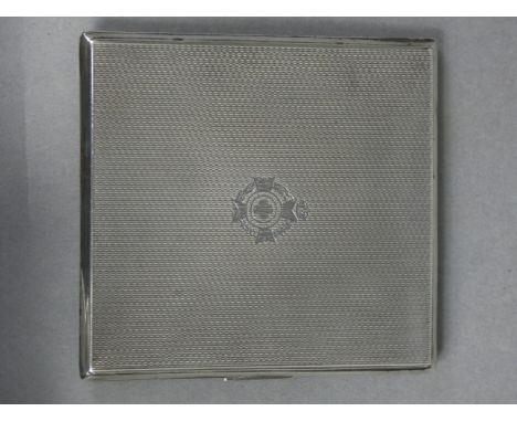 A silver engine-turned pocket cigarette case with engraved Army Chaplain’s badge, the interior with engraved inscription: “Ma