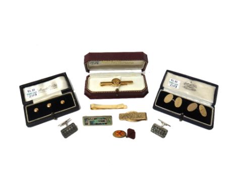 A pair of 9ct gold oval cufflinks, engine turned to one side and engraved with initials to the other side, a set of three 9ct