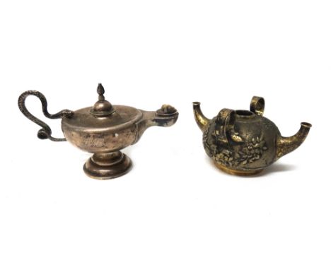 A late Victorian silver table lighter, modelled as a Roman oil lamp, the handle formed as a coiled snake, the detachable cove