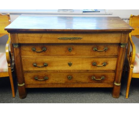 An early 19th century French gilt metal mounted fruitwood and walnut four drawer commode with split turned columns, 127cm wid