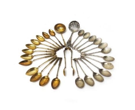 Twelve silver coffee spoons, having scallop shell shaped bowls and with twist motifs to the handles, a sugar sifting spoon, S