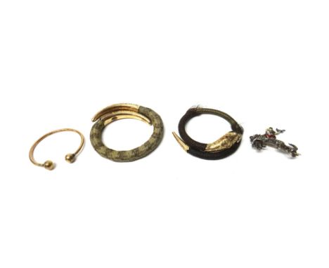 A 9ct gold torque design bangle, weight 8.12 gms, a silver and marcasite set bucking bronco brooch, a Victorian woven hairwor