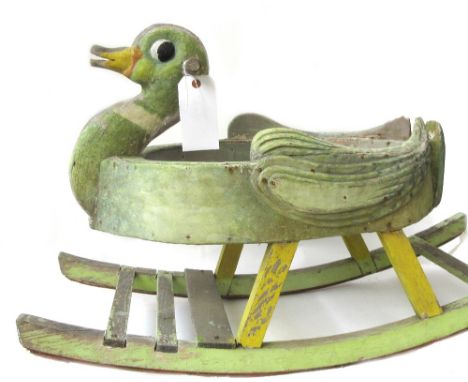 A child's polychrome painted wooden rocking duck on slatted bow rockers, 90cm long, and a black painted tin weather vane, mod