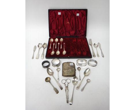 Silver, comprising; four napkin rings, a cigarette case, a pair of sugar nips, circa 1800, two butter knives, a fork, four sa